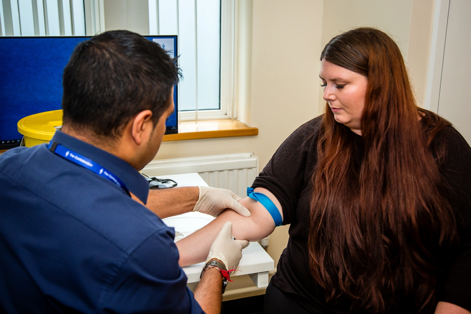 adult receiving a blood test