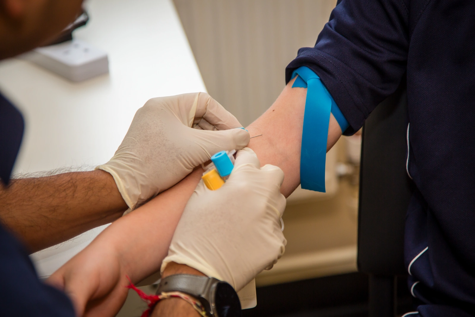 child receiving a blood test