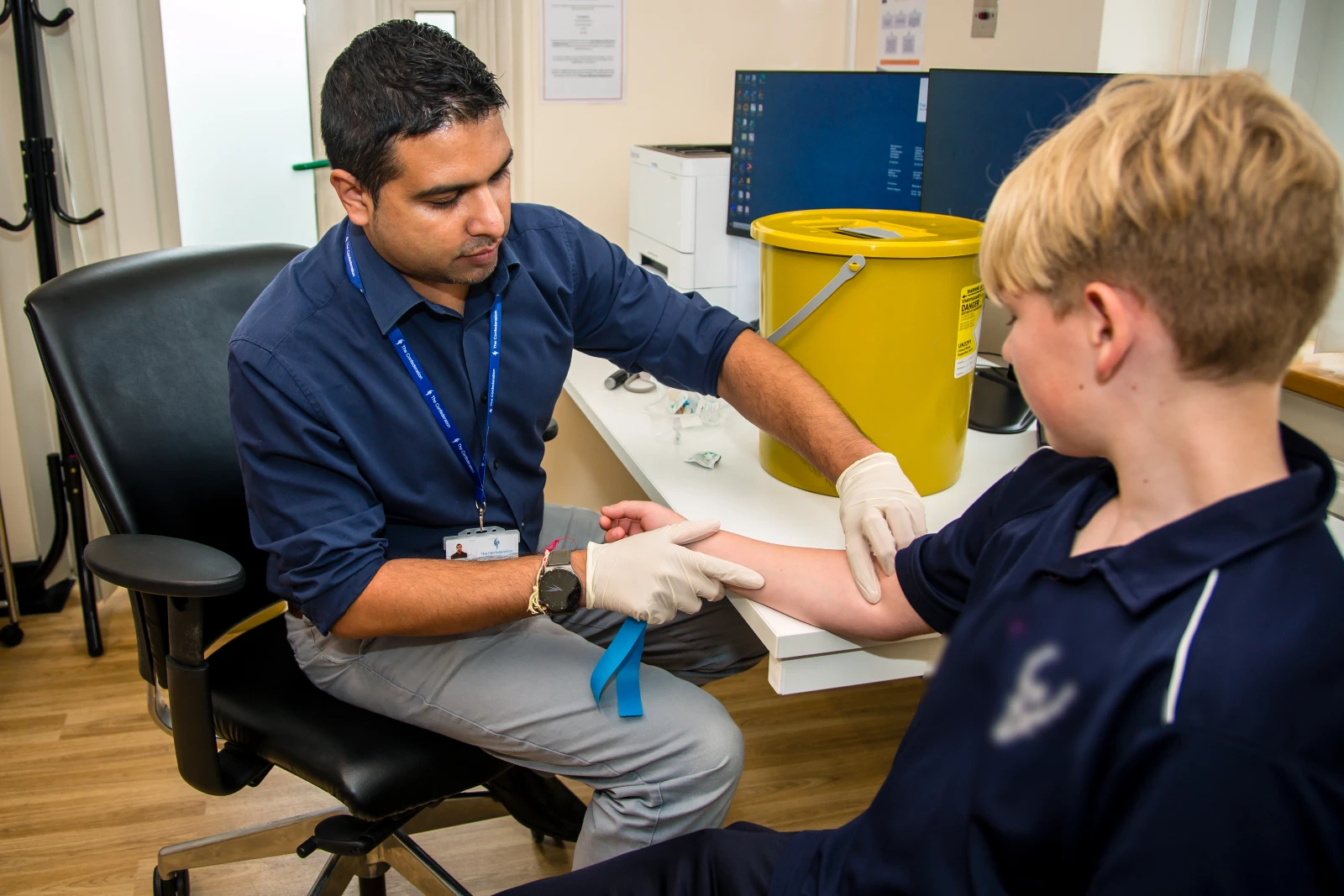 child receiving a blood test